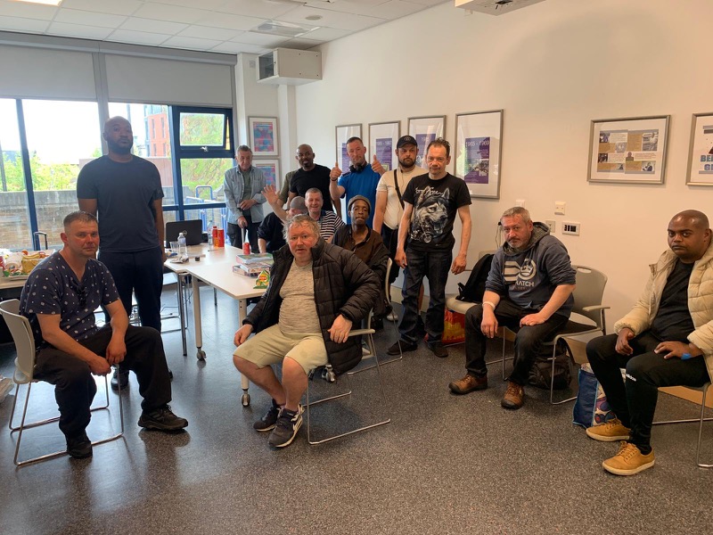 People gathered together at a community drop-in session